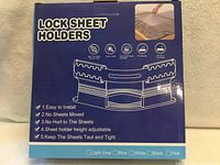 front of sealed box showing product name and illustration of sheet holders