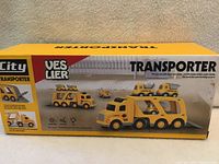 Front/top of sealed Veslier City Transporter box showing hauler and small vehicles