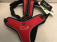 Front view red/black Excellent Elite Spanker dog harness with tags and D-ring visible