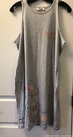 Front view of grey nightie on hanger showing text and graphic