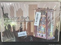 Front of sealed box showing product name and shrink wrap