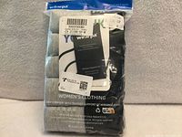 Front of sealed Wirarpa package showing branding, size M label and five rolled briefs inside