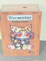 Front of sealed puzzle box showing brand, illustration, piece count, size and difficulty