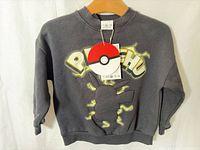 Front view of grey Pikachu sweatshirt with tag attached