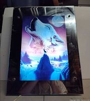 Front view showing wolves image and mirrored border