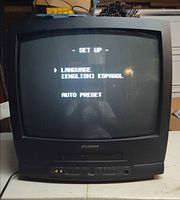 Full view of powered-on Sylvania 19" CRT TV/VCR combo showing setup menu