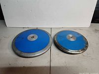 Two blue discus plates side by side