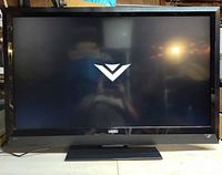 Front view showing screen on with Vizio logo