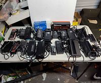 Wide view of entire lot of adapters on table