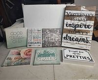 Group shot of all seven decorative quote signs