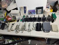 Full lot overview showing card readers, slot modules, floppy drive, keypad, manuals and PCBs