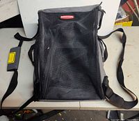 Overall view of Rubbermaid pet carrier backpack showing mesh front, straps, structure