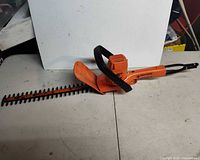 Full view of hedge trimmer showing blade, body and cord