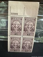 Full view of four-stamp plate block with selvage showing plate number 22585