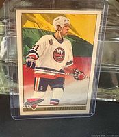 Front view of Darius Kasparaitis Topps Premier card in protective sleeve