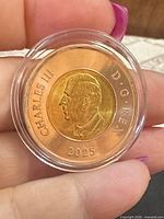 Obverse showing King Charles III effigy, year 2025, clear capsule