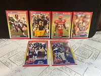Front view of all six 1990 Score cards in holders