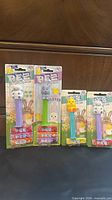 Four sealed Pez Easter dispensers on blister cards