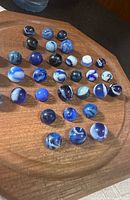 marbles arranged on wooden tray