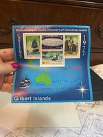 full souvenir sheet front view held by hand