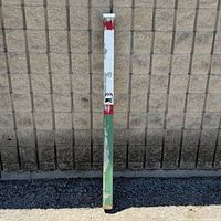 Full view of TTC bus stop stand showing height and coloration