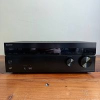 Full front view of Sony STR-DH540 receiver on wooden surface