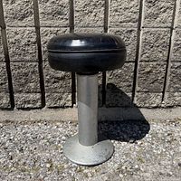 Full view of stool showing seat, column and base