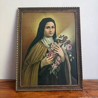 Front view of framed painted tin portrait