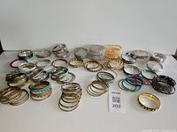 overview of all assorted bangles spread on white surface