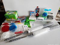 All items laid out showing variety of cleaning supplies