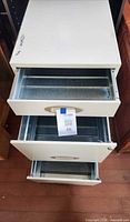 Top view of cabinet with two drawers open showing metal interiors