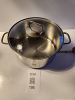 Top view showing stainless steel stock pot interior and glass lid