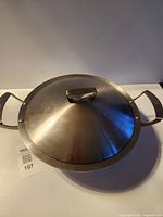 closed wok with lid on, showing overall shape and handles