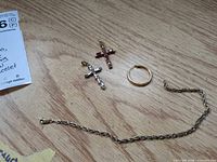 Overview of chain, two pendants, and one hoop earring