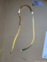 Full view of herringbone necklace laid flat