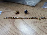 Overview of bracelet and two rings on table