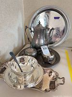 Full set showing all eight silver-plated pieces