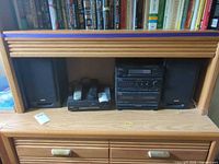 Entire stereo system with speakers in cabinet