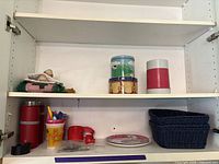 Cabinet shelves showing most items grouped