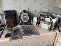 Group shot showing all frames and albums on dresser