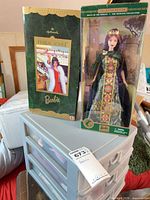 Two boxed Barbie dolls on plastic crate: Holiday Voyage and Princess of Ireland