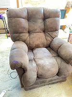 Front view of brown microfiber recliner showing overall design and wear