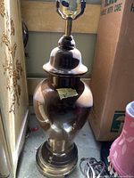 Brown ceramic table lamp with socket visible