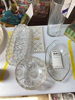 Group view of all five clear glass pieces