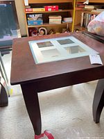 full view of dark brown veneer end table