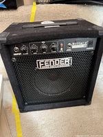 Front view of Fender Rumble 15 amplifier showing grille, logo, control panel