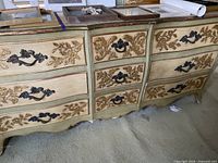 Full front view of 9-drawer dresser showing finish, hardware, and wear