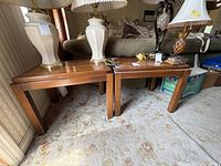 Pair of Lane cherry wood end tables side by side with lamps on top