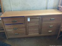Front view of dresser showing drawer layout and hardware