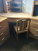 Overall view of L-shaped desk with chair and pedestals